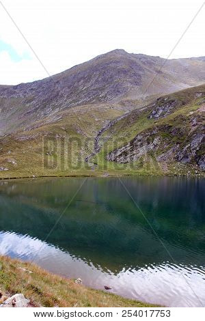 Glacial Lake - Sky And Mountains Reflected In The Water