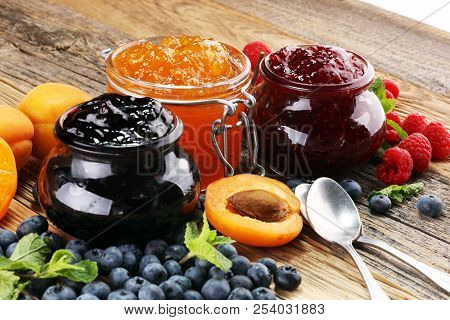 Assortment Of Jams, Seasonal Berries, Apricot, Mint And Fruits. Marmalade Or Confiture