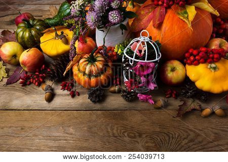 Fall Arrangement With White Birdcage And Pumpkin