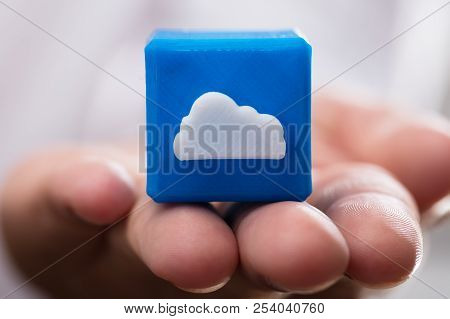 Businessperson Holding Cloud Icon Cubic Block
