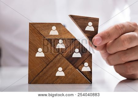 Businessman Building Tangram Square Block