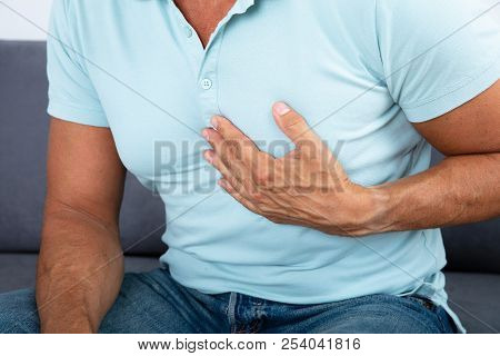 Close-up Of A Man With Chest Pain Suffering From Heart Attack