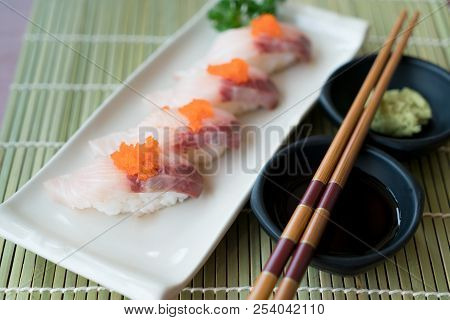 Hamachi Sushi On White Plate Along With Japanese Sauce And Green Leaf Decoration, Japanese Food, Clo