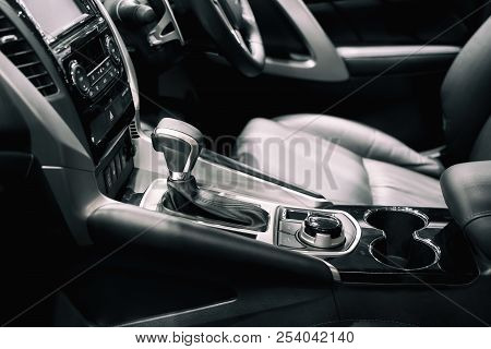 Luxury Of Car Interior At Transmission Shift Gear Area. Modern Car Interior, Gearstick Radio And Cup