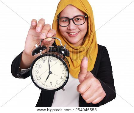 Young Businesswoman Holding A Clock