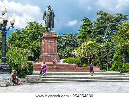 Jalta, Ukraine - August 16, 2012: Local People Under The Lenin Monument In Nekrasoy Park