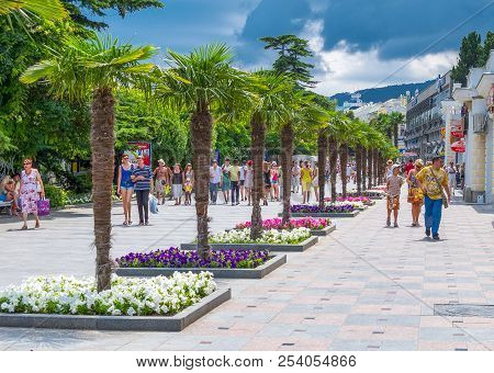 Jalta, Ukraine - August 16, 2012: Local People In The Waterfront Pedestrian Walkway Along The Black 