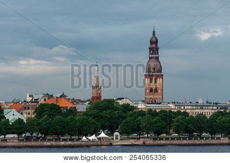 View Of The Spiers Of The Cathedrals Of The Old City Of Riga, From The Daugava River