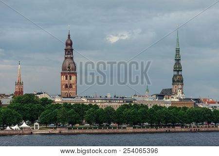 View Of The Spiers Of The Cathedrals Of The Old City Of Riga, From The Daugava River