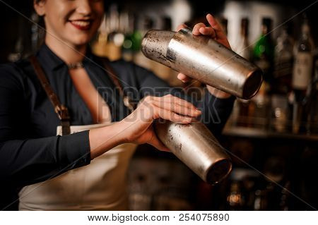 Beautiful Sexy Smiling Barmaid With A Deep Neckline Making A Fresh Summer Cocktail In Shaker
