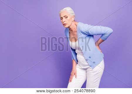 Gray Haired Old Beautiful  Woman Wearing Casual Suffering From Back Pain. Empty Blank Copy Space. Is