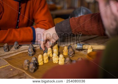 Two Men Playing Popular Strategy Board Game - Tafl