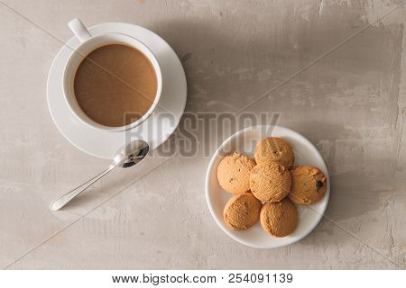 White Cup Of Creamy Coffee With Butter Cookies And Stainless Teaspoon Isolated On White Background, 