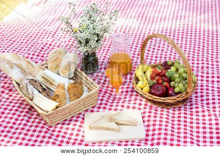 Picnic Bread Crossiant Basket With Fruit On  Red White Cloth