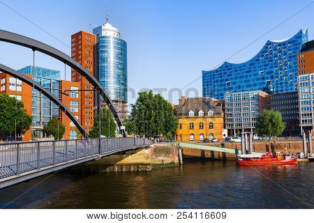 City Of Warehouses Or Speicherstadt District, Niederbaumbridge Bridge And Kehrwiederspitze In Hambur