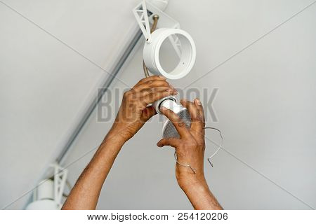 Electric Hand Lamps With Ceiling Led Lamp, Spotlight. The Concept Of Repair And Maintenance.