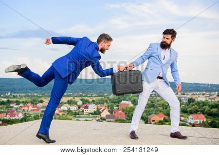 Business Deal Landscape Background. Businessman Takes Away Briefcase From Business Partner. Fraud An