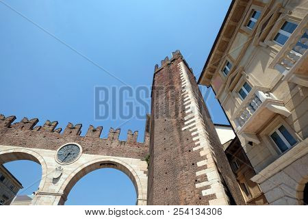VERONA, ITALY - MAY 27: Corso Porta Nuova street and medieval Gates Portoni della Bra on Piazza Bra in Verona, Italy, on May 27, 2017.