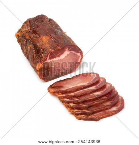 Piece of spanish Lomo Embuchado meat and slices isolated on white background