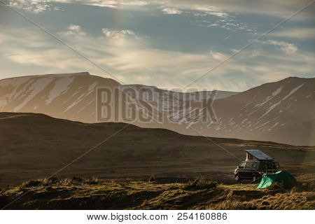 Highlands of Scotland - someone found a lovely spot for tonight - camper and a tent in a splendid landscape