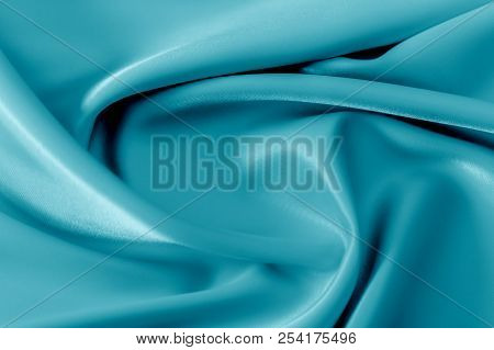 Smooth Elegant Shiny Turquoise Silk Or Satin Luxury Cloth Texture Can Use As Abstract Holidays Backg