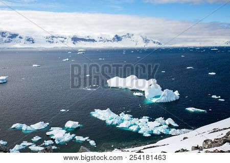 Ice In The Antarctica With Iceberg In The Ocean