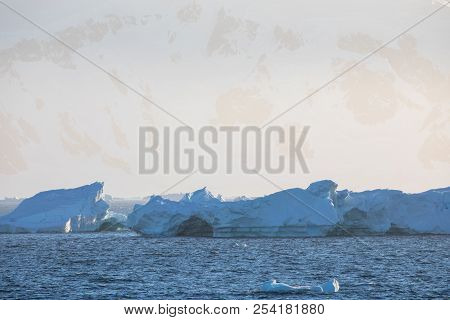 Ice In The Antarctica With Iceberg In The Ocean