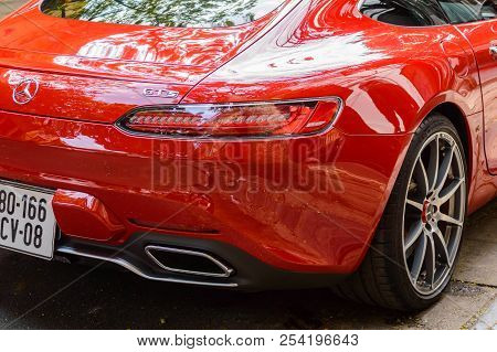 Vietnam, Hanoi, December 06, 2016: Red Supercar Mercedes Gts On A Street Of City. Fragment Of Exteri