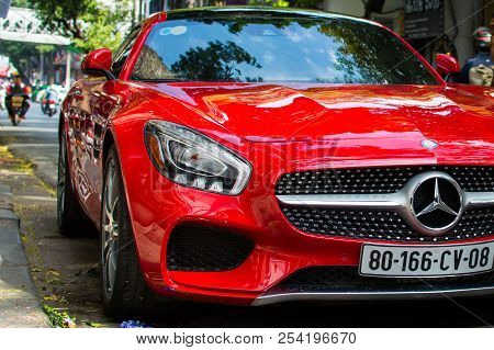 Vietnam, Hanoi, December 06, 2016: Red Supercar Mercedes Gts On A Street Of City. Fragment Of Exteri