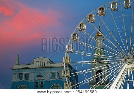 The Ferris Wheel In The Historical Part Of Kyiv On The Kontraktova Square On Podol In The Evening, K