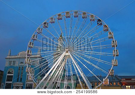 The Ferris Wheel In The Historical Part Of Kyiv On The Kontraktova Square On Podol In The Evening, K