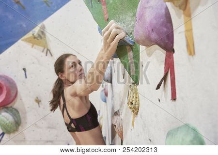 Woman With Perfect Fit Body Training On A Climbing Wall In Sport Hall, Doing Exercise, Workout