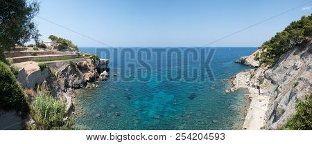 Panoramic View Of Beautiful Landscape On Balearic Island Of Mallorca Against Turquoise Sea And Clear