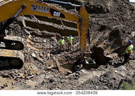 Fargo, North Dakota, August 14, 2018: Founded In 1925, The Cat Excavator Moving A Scoop Of Earth Is 