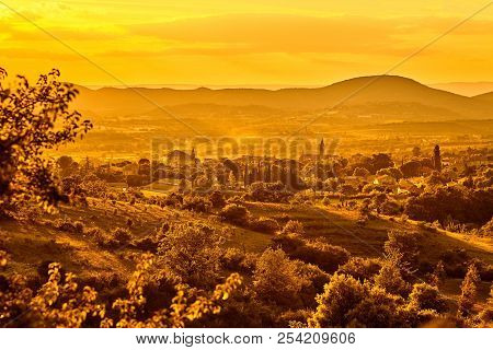 French Town,  Fields And Vineyards At Sunset. Beautiful Scenic View Of Barjac City, South France, Eu