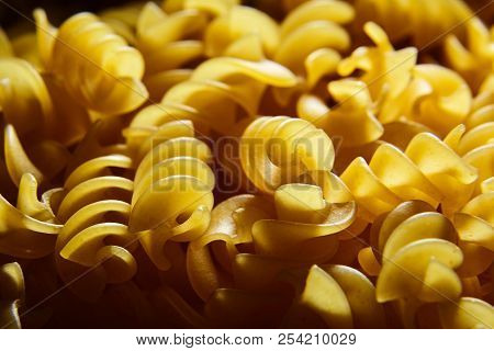 Raw Uncooked Dry Italian Fusilli Pasta. Corkscrew Spiral Shape