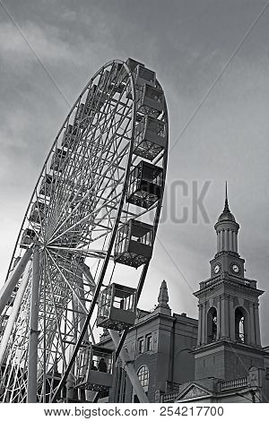 The Ferris Wheel In The Historical Part Of Kyiv On The Kontraktova Square On Podol In The Evening, K