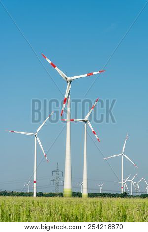 Wind Energy Generators In A Wide Open Landscape In Germany