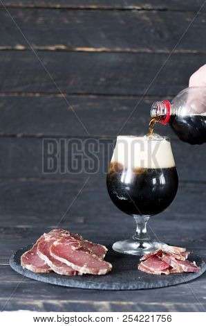 Pouring Of Dark Beer In A Glass. A Glass Of Dark Beer.