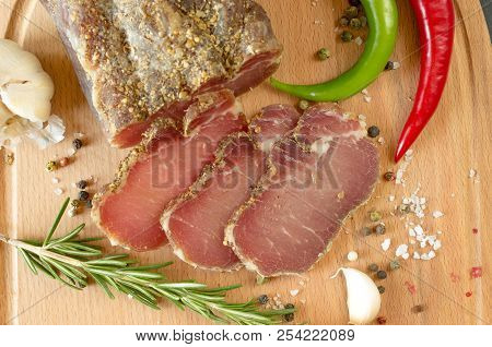 Dried Beef. Sliced Beef Jerky.meat On A Wooden Board.