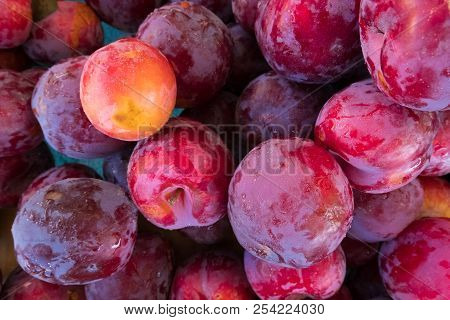 Fresh Plum Stand At A Street Organic Food Market.