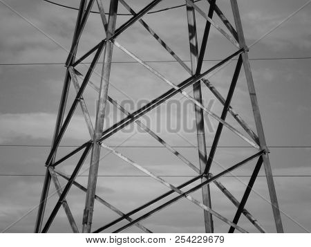 Fragment Of High-voltage Tower. Power Line. Metalware. Black And White Photo. Bnw. Urban