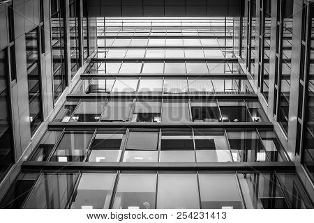 Black And White Gray City Window Of Business Center. Look Up At The High Glass House.