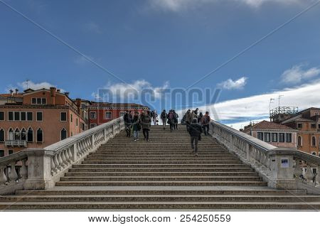 Venice, Italy - March 20, 2018: Ponte Degli Scalzi Bridge Grand Canal Tourists Boats Venice Italy. B