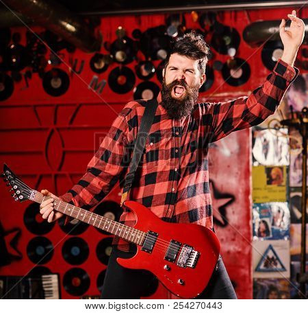 Frontman Concept. Talented Musician, Soloist, Singer. Musician With Beard Play Electric Guitar Instr