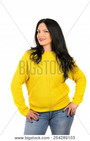 Casual Woman Posing In Yellow Sweater And Jeans Isolated On White Background