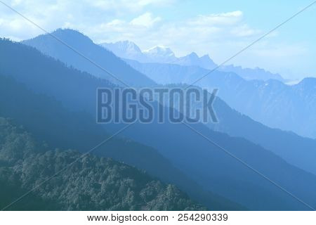 Morning Mountain Landscape With Layer Of Mountain Peaks Covered With Coniferous Deciduous Forests. V