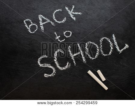 Back To School Concept. Education Background With  Chalk Pieces On Black Chalkboard.