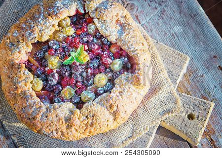Summer Crostata Or Galette Pie With Fresh Garden Berries