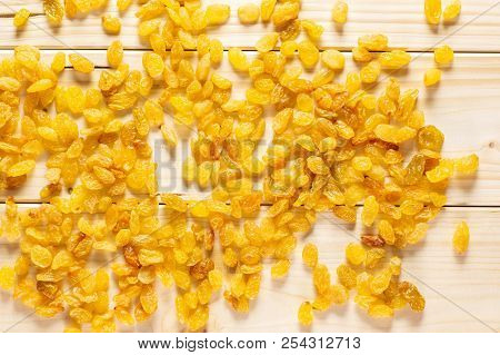 Lot Of Whole Dry Golden Raisins Sultana Variety Flatlay On Natural Wood